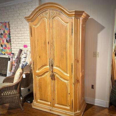 Pine armoire with lock and interior drawers
