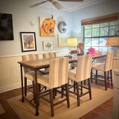 98" long bar-height dining table. Six chairs shown, but can seat 8-10. Chairs are bar-height, with gray and white striped upholstery.