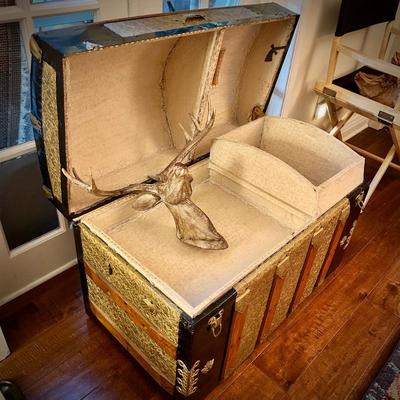 Vintage steamer trunk with wood deer head