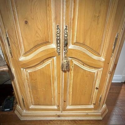 Pine armoire with lock and interior drawers