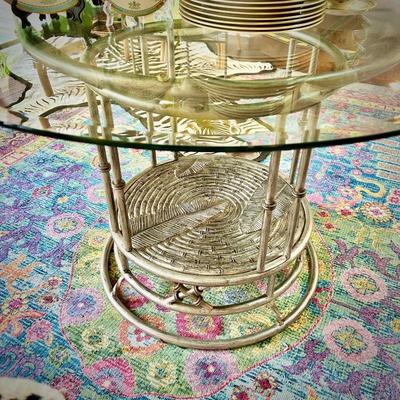 Glass dining table with metal base