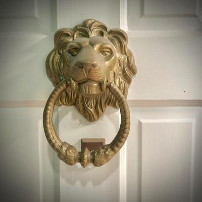 Brass lion head door knocker