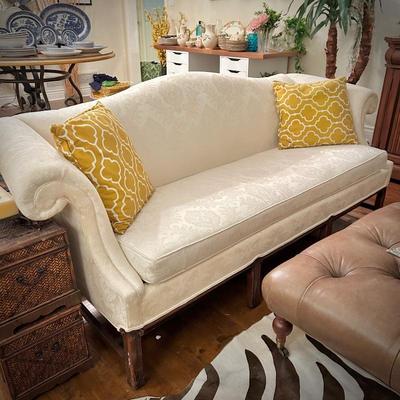Ivory Chippendale-style camelback sofa