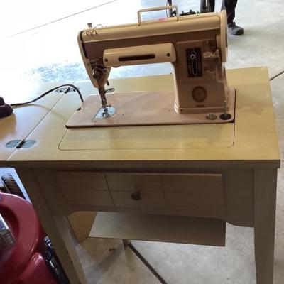 Sale Photo Thumbnail #41: 1950s sewing table and machine. Need needs repaired.