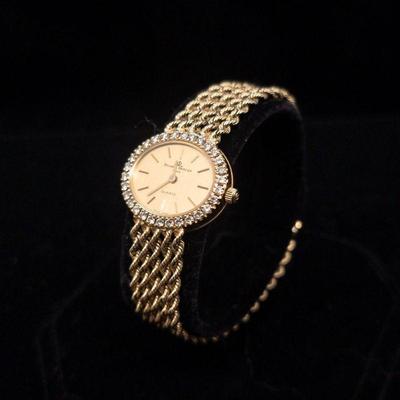 Baum Mercier 14k and diamond watch