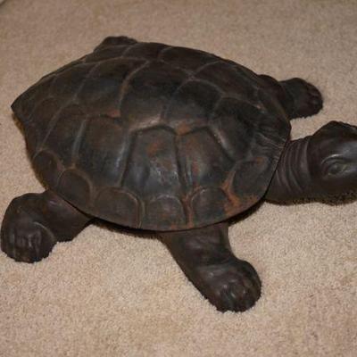 Antique turtle spittoon. You step on his head and the shell opens to display the spittoon