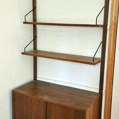 1146B	MID CENTURY MODERN DANISH WALL SHELF WITH 3 SHELVES AND DOUBLE DOOR CABINET, APPROXIMATELY 33 IN X 17 IN X 78 IN H
