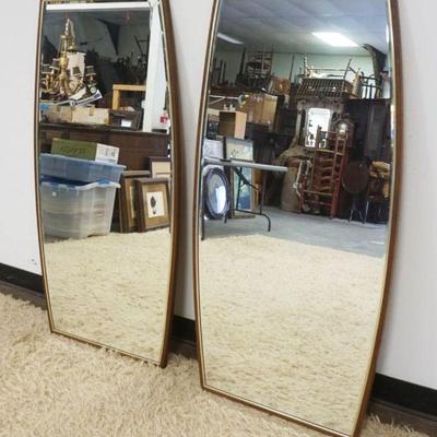 1119	PAIR OF MID CENTURY MODERN BEVELED EDGE MIRRORS IN WALNUT FRAMES, EACH APPROXIMATELY 24 3/4 IN X 49 1/2 IN

