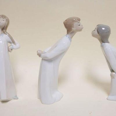 1014	LLADRO PORCELAIN FIGURES, GIRL STRETCHING & KISSING BOY & GIRL, APPROXIMATELY 8 IN HIGH
