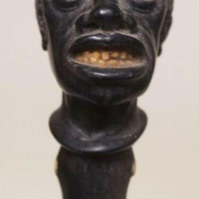 Sale Photo Thumbnail #39: 1039	ANTIQUE FOLK ART AMERICAN CARVED BLACK HEAD WALKING STICK W/DETAILED CARVING, GLASS EYES & CARVED TEETH & INSET BONE ACCENTS, APPROXIMATELY 34 IN
