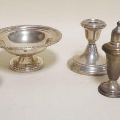 1102	STERLING SILVER WEIGHTED GROUP INCLUDING COMPOTE, CANDLESTICKS, ETC., TALLES PIECE APPROXIMATELY 4 IN
