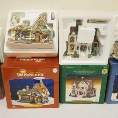 Sale Photo Thumbnail #260: 1261	GROUP OF 4 PORCELAIN SANTAS WORKBENCH COLLECTION BUILDINGS IN BOXES
