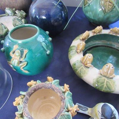 Ceramic pots adorned with frogs