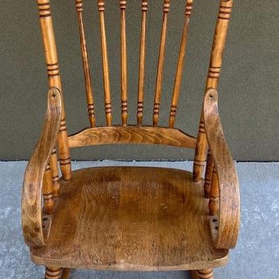 Antique Spindle Back Bent Wood Rocker With Carved Top