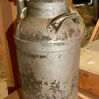very heavy old milk can