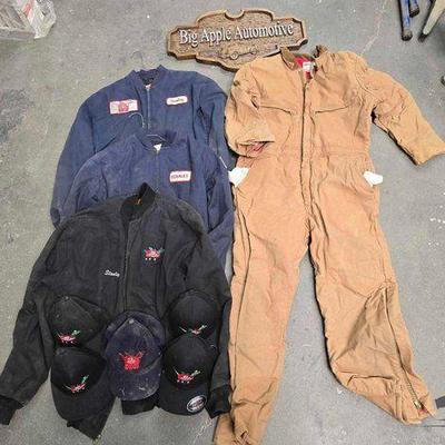 #2136 • (3) Work Jackets, (1) Coverall, (5) Hats, and (1) Big Apple Automotive Wood Sign