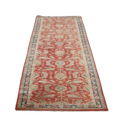 RED LEAF PATTERN RUNNER (2 Of 2) | An antique style corridor rug with scrolling floral pattern on a red ground within a blue border. - w....