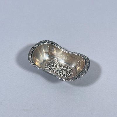 800 SILVER BOWL | Designed with stamped rose relief, marked on back “800” 0.4 ozt. - h. 0.75 x w. 1.5 x l. 2.75 in

