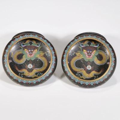 PAIR DRAGON CLOISONNE BOWLS | Chinese cloisonne bowls with yellow dragons in the center on a black ground and chasing dragons around the...