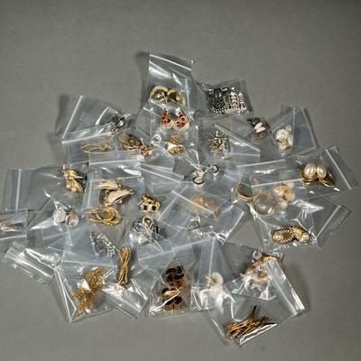 COLLECTION COSTUME JEWELRY EARRINGS | Assorted Gold and Silver toned costume earrings, including some clip ons.

