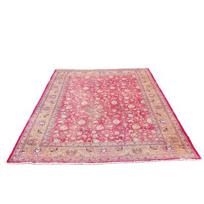 PERSIAN STYLE CARPET | Having an overall pattern with animals on a red ground within floral borders. - w. 12' 11" x l. 9'...