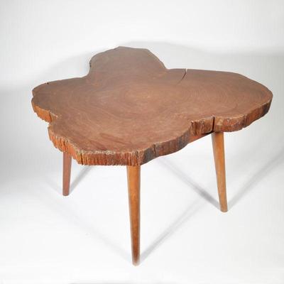 NAKASHIMA STYLE TEAK LIVE EDGE TABLE | Modern style side / low table having a natural "live edge" wood top on a base with four...