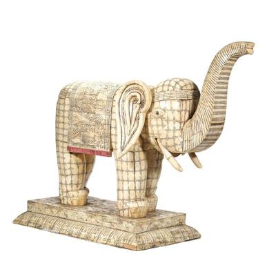 MONUMENTAL INDIAN/CHINESE CARVED BONE ELEPHANT | Decorated with a mosaic patchwork of carved bone, the elephant with trunk raised and...