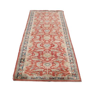 RED LEAF PATTERN RUNNER (1 Of 2) | An antique style corridor rug with scrolling floral pattern on a red ground within a blue border. - w....