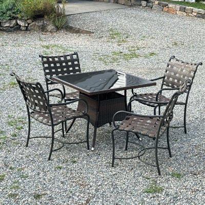 (5pc) PATIO SET | Outdoor dining suite comprising: 4 curved metal and woven armchairs with x-stretcher and woven square table with glass...