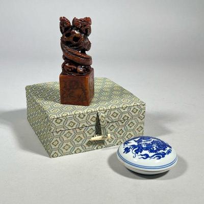 DAVID MOSS CHINESE STAMP & BOX | Carved stone Chinese stamp with twisted dragons and dragon decorated blue and white porcelain lidded...