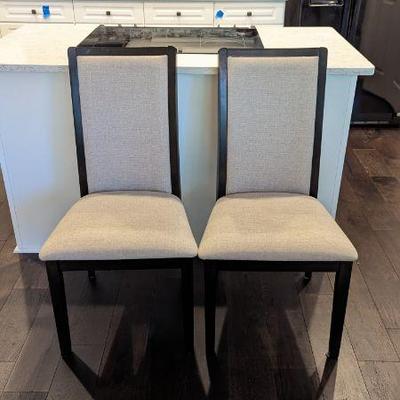 Lot #25 - Set of 4 Modern Upholstered Dining Chairs - Sleek Black Frame with Tan Fabric