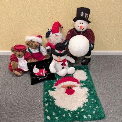 Lot #94 - Holiday Decor and Plush Collection - Variety of Festive Figurines and Stuffed Animals with Santa and Snowman Themes