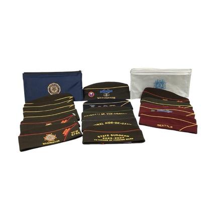 WATA556 Collection Of Vfw Caps And Bags	15 caps with badges and 6 plastic zip up bags (2 American Legion) Most are sz 7 1/8.
