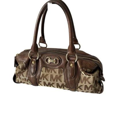 KAAR900 Vintage Michael Kors Signature Logo Handbag	This vintage Michael Kors is in good condition besides one spot with some wearing on...