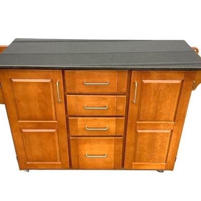 TEWA600 Granite Top Mobile Island Cart	This lot includes a mobile kitchen island with a dark colored slab 
