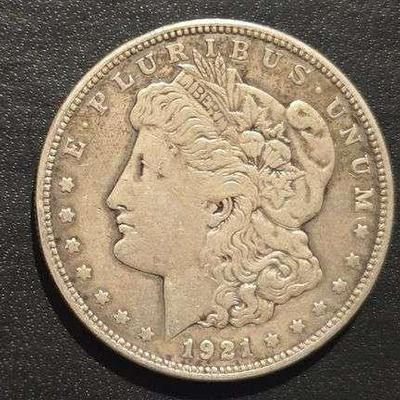 1921 MORGAN SILVER DOLLAR 90% SILVER 26.73 grams (. 859 troy ounces) and is composed of 90% silver and 10% copper, - 0.77344 troy ounces...
