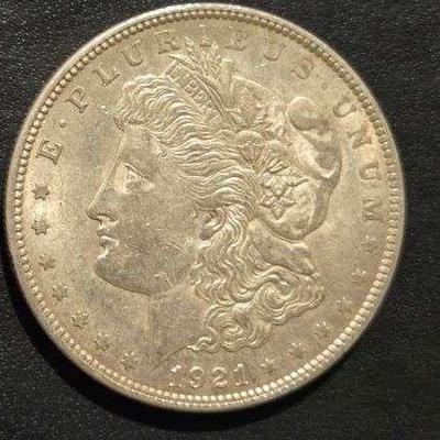 1921 MORGAN SILVER DOLLAR 90% SILVER 26.73 grams (. 859 troy ounces) and is composed of 90% silver and 10% copper- 0.77344 troy ounces of...