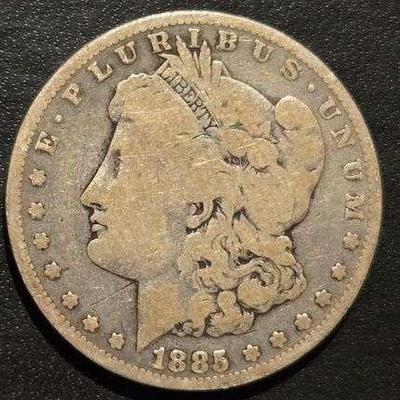 1885 MORGAN SILVER DOLLAR 90% SILVER 26.73 grams (. 859 troy ounces) and is composed of 90% silver and 10% copper, - 0.77344 troy ounces...