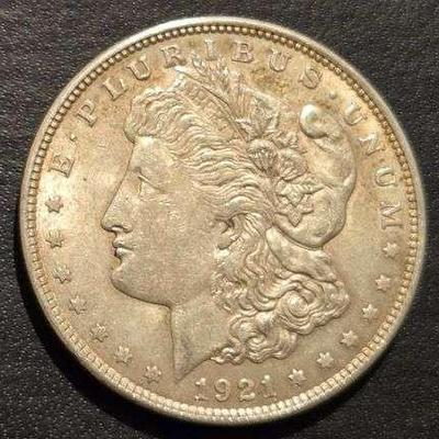 1921 MORGAN SILVER DOLLAR 90% SILVER 26.73 grams (. 859 troy ounces) and is composed of 90% silver and 10% copper- 0.77344 troy ounces of...