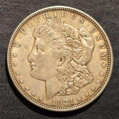 1921 MORGAN SILVER DOLLAR 90% SILVER 26.73 grams (. 859 troy ounces) and is composed of 90% silver and 10% copper- 0.77344 troy ounces of...
