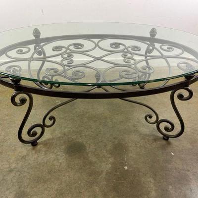 Oval Glass Top Coffee Table with Scrolling Metal Base
