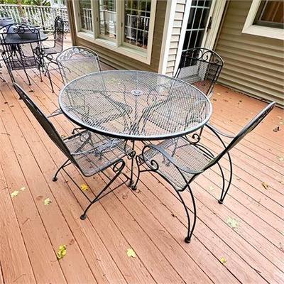 Lot 307   
Wrought Iron Patio Table with Four Chairs