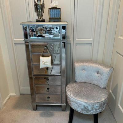 Elegant Powder Room Setup: Mirrored Chest, Velvet Chair, & More	