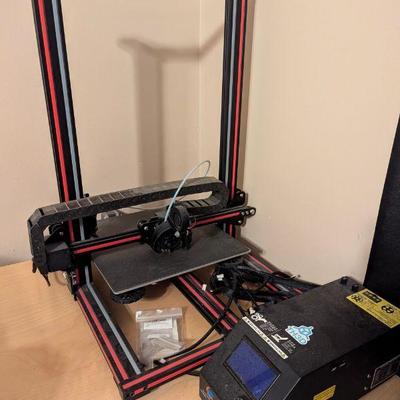 Crealty 3D printer with accessories.