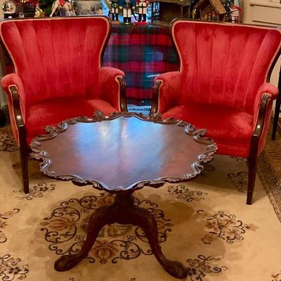 Red chairs, pie crust table