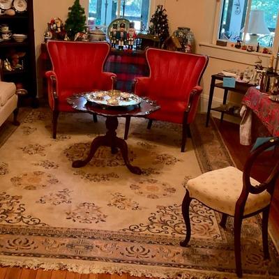 Red velvet chairs, pie crust table