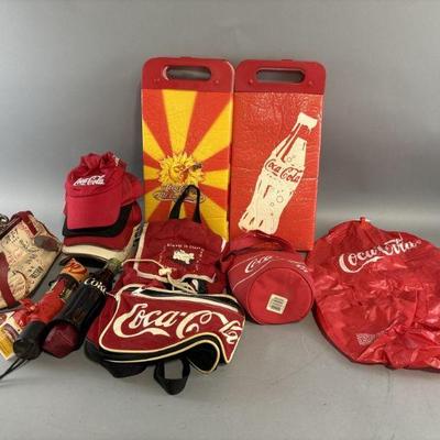 Lot 107 | Coca- Cola Umbrellas, Bags, Hats, & More
