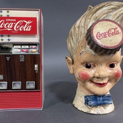 Lot 104 | Vintage Coca-Cola Banks Cast Iron & Musical
