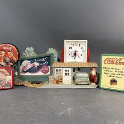 Lot 320 | Vintage Coca-Cola Ad Tins & Quartz Wall Clock
