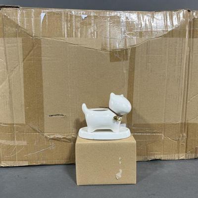 Lot 444 | 24 Dog or Cat White Ceramic Planters & Trays
